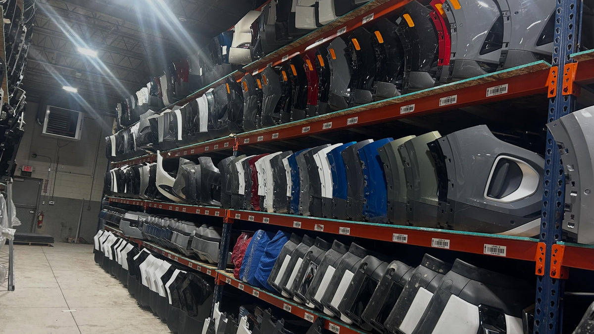 Rows of OEM body parts on racking in the PowerPlusPart warehouse