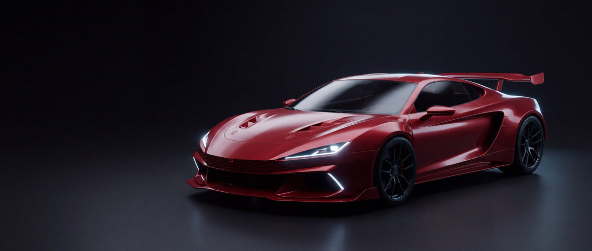 A red sports car in a dark studio